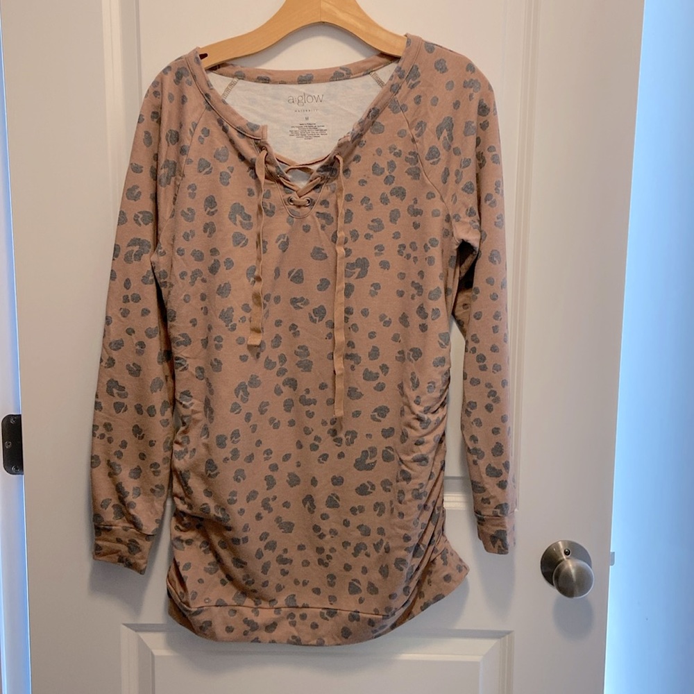 A Glow maternity cheetah print lace front tunic sweatshirt